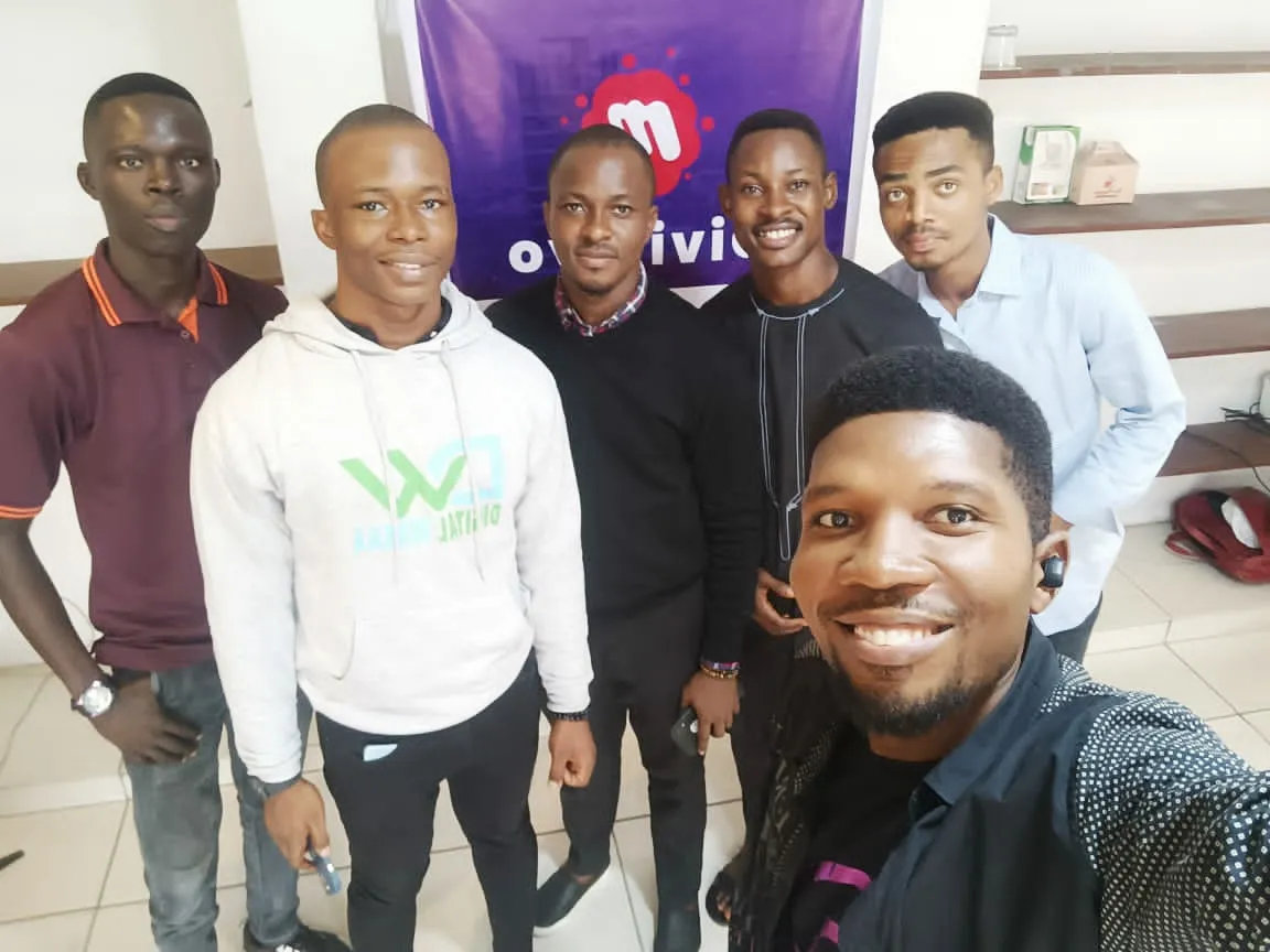 6 men standing next to each other at the Divi Uyo meetup